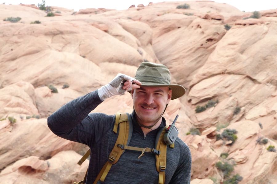 Boone grinning in red rock desert country